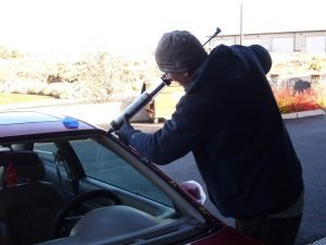 Rimrock Autoglass sealing a replacement windsheild